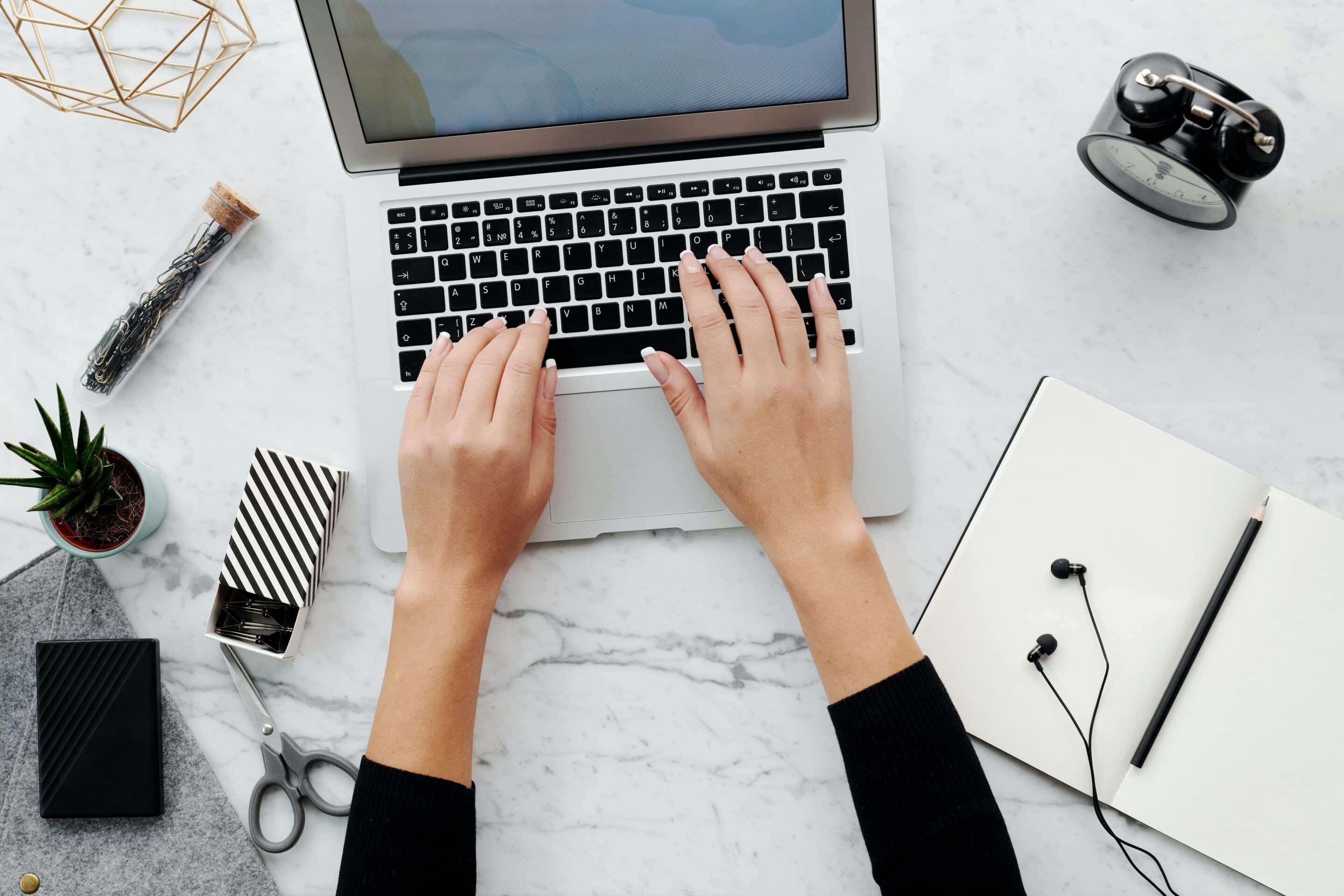 Woman typing on laptop